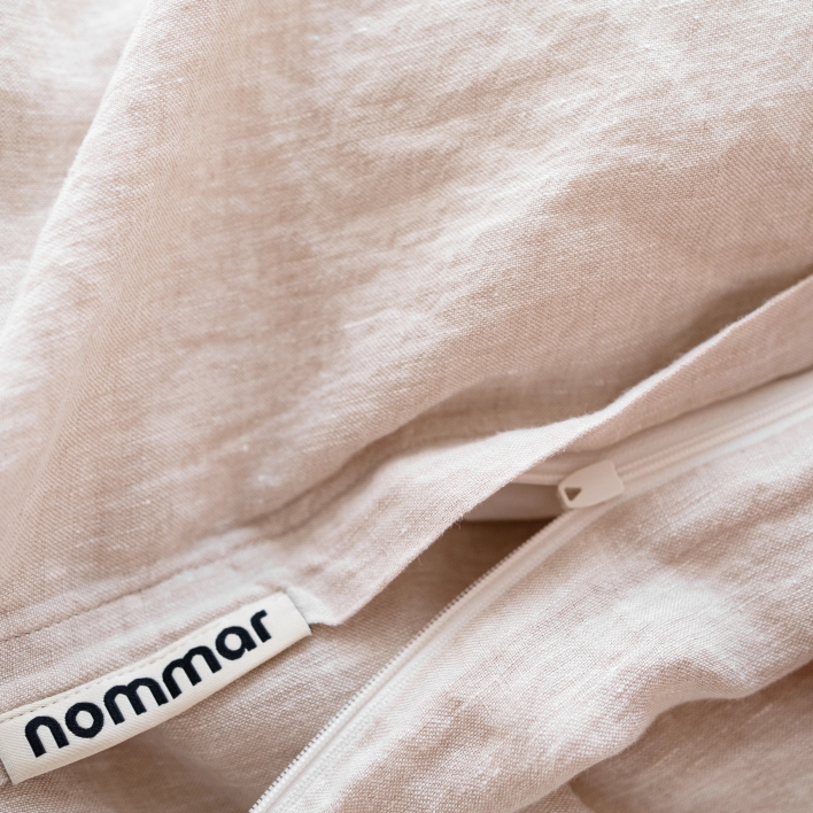 Handmade beige linen duvet cover with smooth hidden zipper closure.