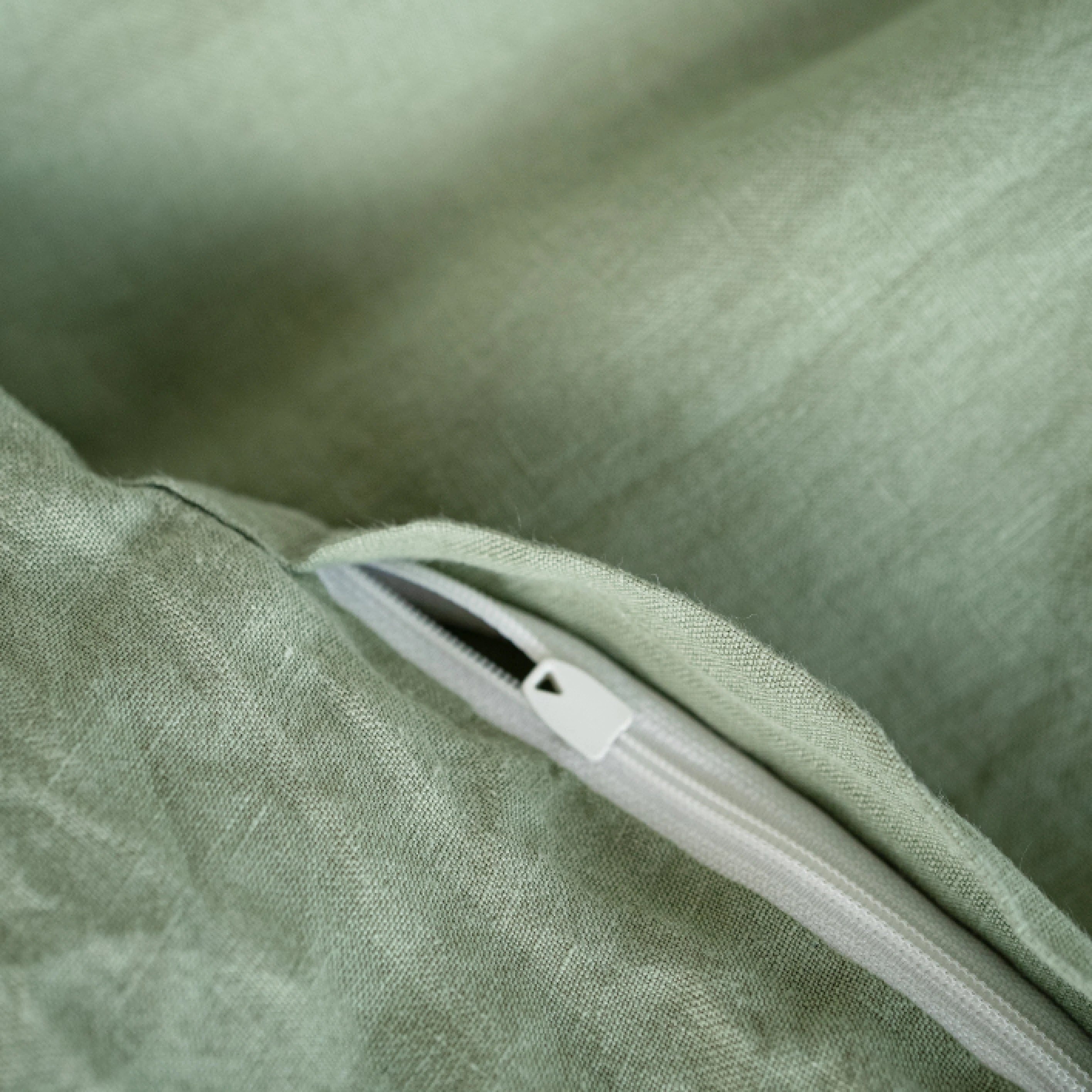 Handmade sage green linen duvet cover with hidden zipper closure.