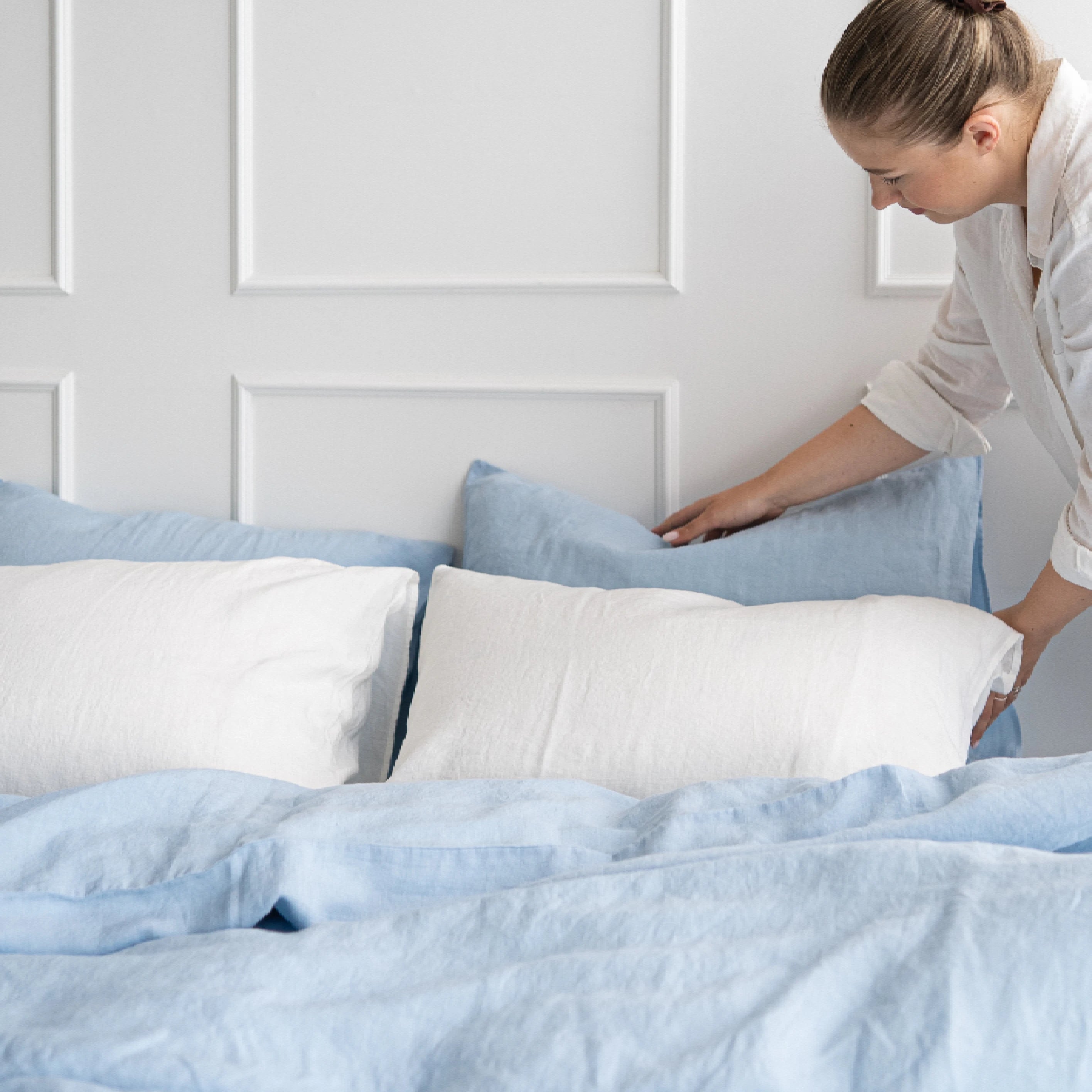 Calming powder blue linen duvet set styled in a peaceful bedroom.