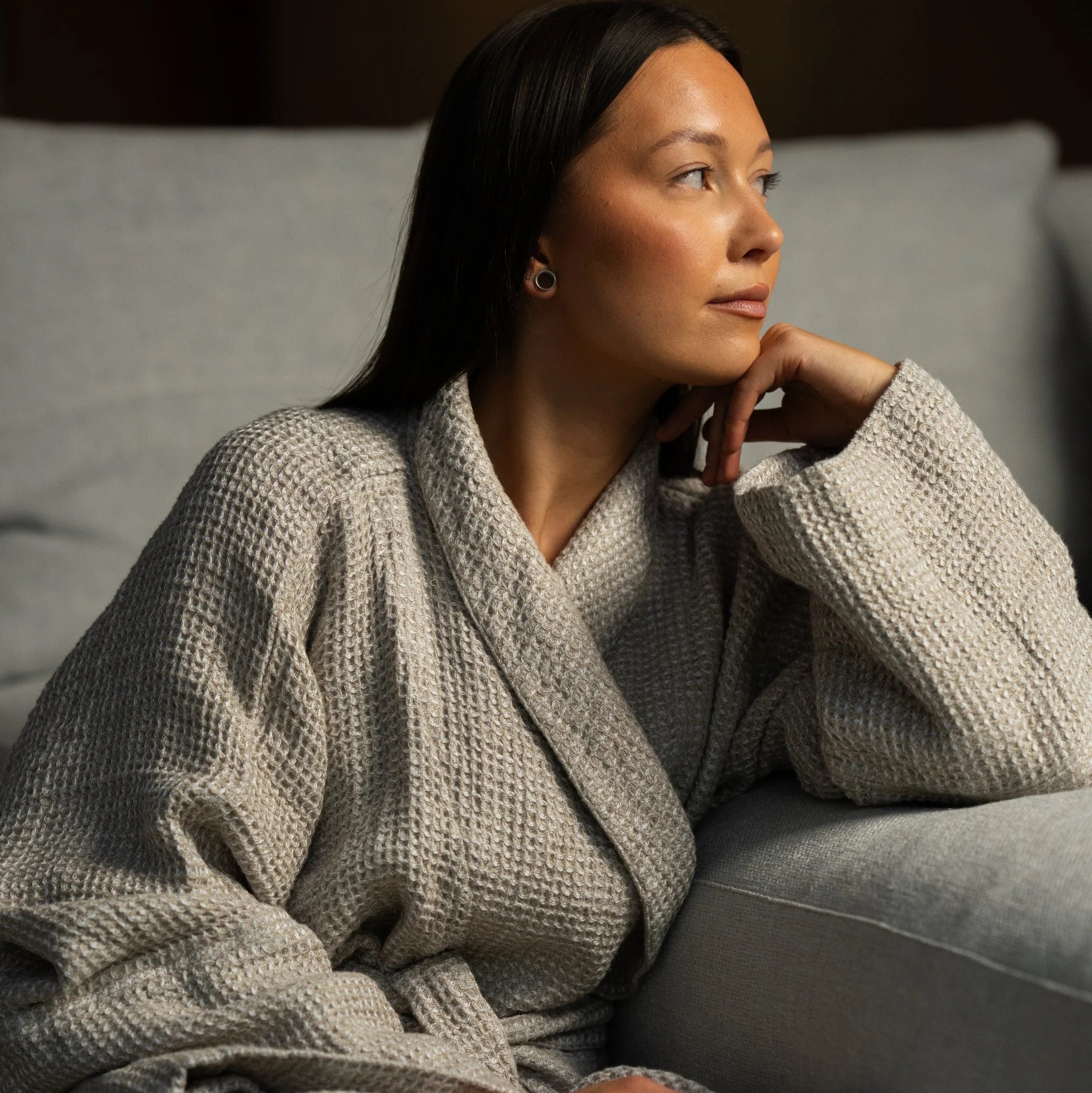 Beige linen robe with double-layered sleeves, designed to hold their shape when rolled and fall naturally when worn long